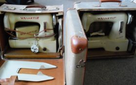 A pair of vintage Helvita sowing machine