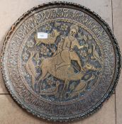 A copper Islamic charger with scalloped