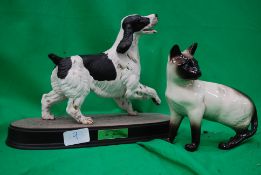 A Beswick cat and a Beswick dog on plint