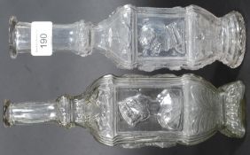 Two Victorian hand blown glass bottles depicting Queen Victoria and Prince  Albert along with other