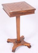 A 19th century Rosewood pedestal games table with inset inlaid chess board having single drawer