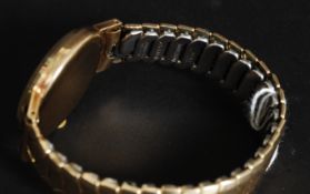A vintage 9ct gold gentlemans Excalibur 21 jewel Incabloc watch with the original strap ( plated )