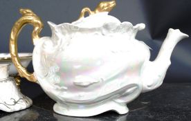 A 20th century Victorian style pearlescent part dinner service- to include egg cups, tea pot.