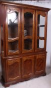 A 20th century French style sideboard display cabinet having cabinets to the base with glazed