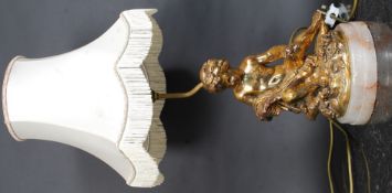 A gilt plaster work Cherub in classical pose table lamp mounted on marble base with shade H64cm