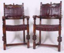 A pair of 1940's Jacobean revival oak carver armchairs.