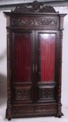 A 19th century French dark oak bookcase armoire.