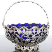A continental silver ( tested) and blue glass lined bon bon dish.