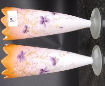 A pair of hand painted tapered vases.