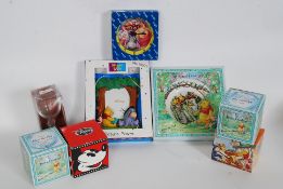 A collection of Disney and Winnie The Pooh boxed ornaments to include Royal Doulton plate,