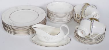 A Royal Doulton Simplicity pattern part dinner / tea service comprising dinner plates,cups, saucers,
