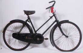 An early good ladies loop frame bicycle with early 3 speed gearing.