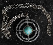 A Jorgen Jensen pewter pendant & long necklace of geometric pierced circular form set with a