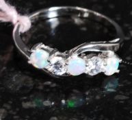 A silver white metal CZ and Opalite set ring.