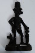 A  Cast Metal Doorstop, modelled as Aly Sloper and his dog with umbrella,