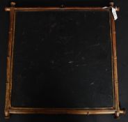 A late 19th century triptych mirror framed in gilt metal being decorated with inset ivorine panel