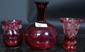 A collection of three pieces of 20th century cranberry glass / etched coloured glass to include