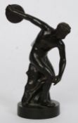 A Grand Tour cast bronze souvenir figure of Discus raised on circular plinth.
