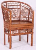 A decorative vintage 'Plantation' cane conservatory chair.