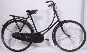 A vintage ladies loop frame bicycle,