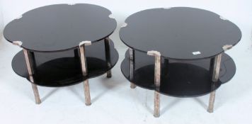 A pair of 1930's Art Deco black glass and chrome flower head shaped occasional coffee tables.