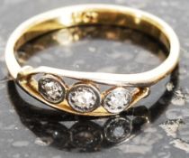 An 18ct gold and diamond ring being set with 3 stones. The diamonds approx .10cts. Total weight 1.