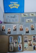 A large quantity of cigarette and tea cards - some loose,