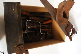 A collection of vintage wood working tools to include saws, drills,