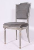 A 20th century painted French Louis 15th style bedroom chair in grey together with an early 20th