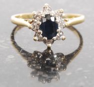An 18ct gold sapphire and diamond flower head ring.