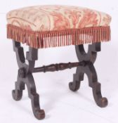 A 19th century oak X-frame upholstered stool in the gothic manner of Pugin.