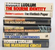 A collection of 7x Robert Ludlum First Edition novels / books to include the Bourne Identity and