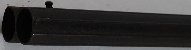 A Victorian twelve bore side by side double barrel  hammer sporting percussion pin fire shotgun.