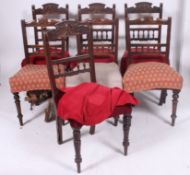 A harlequin set of 7 Edwardian mahogany dining chairs ( 4 + 3 ) all with similar carved back rests,