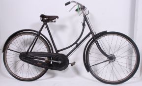 A good vintage Ladies loop frame Raleigh bicycle bike with original leather saddle.