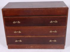 A 1940's post war gentlemans oak chest of drawers having a series of drawers to the chest with the