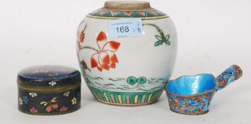 A Chinese famille verte ceramic case of decorative form with water lillies having twin concentric