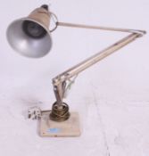A 1940's Herbert Terry two step anglepoise Industrial desk lamp having square terraced base with
