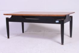 A vintage Ernest Gomme G Plan coffee table with black ebonised frame having brass detailing
H39 x