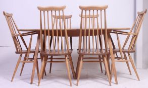 An Ercol elm and beech Windsor dining table, raised on square,