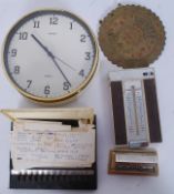A retro Metamec wall clock along with a brass calander,