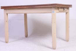A retro farmhouse draw leaf shabby chic kitchen table having a single draw to one end,