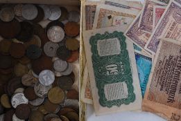 A collection of old bank notes and coins.