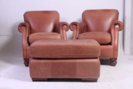 2 Thomas Lloyd brown leather chesterfield armchairs having turned stub mahogany feet with shaped