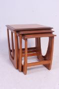 A G-Plan style Kelso nest of teak Danish tables. Each with shaped supports and graduating tops.
