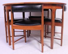 A good 1960's teak wood circular dining room suite in the manner of Frem Rojle.