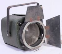 A  vintage 1950's theatre / Industrial Strand light complete with barn doors and handle atop.