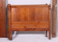 A pretty 19th / 20th century French country fruitwood sleigh bed with serpentine shaped head board