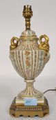 A 20th century porcelain and brass table lamp, with makers label to the base for Porcelain De Paris.
