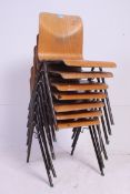 A good set of 8 Industrial mid 20th century stacking chairs having good bentwood panel seats raised